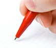 Writing. An hand who writes in a paper sheet with a pen Writing. An hand who writes in a paper sheet with a pen