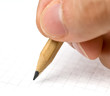 Writing. An hand who writes in a paper sheet with a pencil Writing. An hand who writes in a paper sheet with a pencil