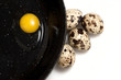 quail eggs on black pan