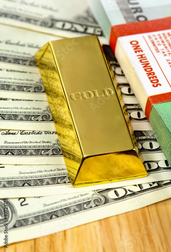 Photo: Money and gold bullion Money and gold bullion