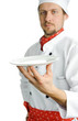 Young chef with a plate
