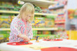 Adorable baby play on table in mall
