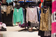 Variety of sweaters and other clothes in mall