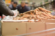 Bunch of carrot on boxes in supermarket