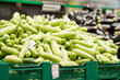 Bunch of zucchini on boxes in supermarket