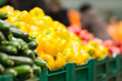Varitey of peppers on boxes in supermarket