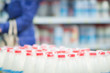 Milk bottles in supermarket