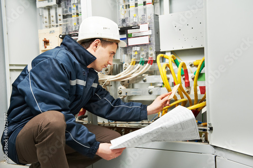 Photo: Electrician checking cabling power line Electrician checking cabling power line