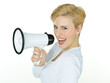Pretty blonde woman shouting through megaphone