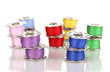 Metal spools of thread isolated on white