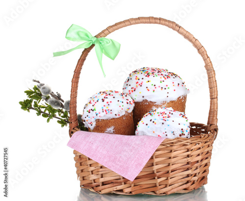 Beautiful Easter cakes and pussywillow twigs in basket isolated