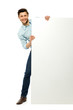 Man peeping from behind the blank board