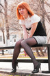 Beautiful woman sitting on a bench Beautiful woman sitting on a bench