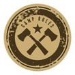 Abstract brown grunge camping stamp with axes.
