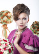 Luxurious woman with bouquets of flowers on white background