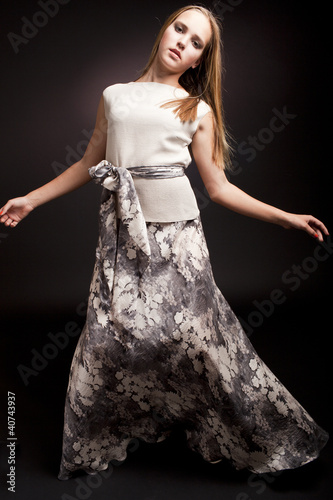 Photo: fashion portrait of sensual young female on dark background fashion portrait of sensual young female on dark background