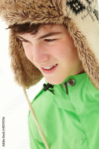 Photo: Portrait Of Teenage Boy In Snow Wearing Fur Hat Portrait Of Teenage Boy In Snow Wearing Fur Hat