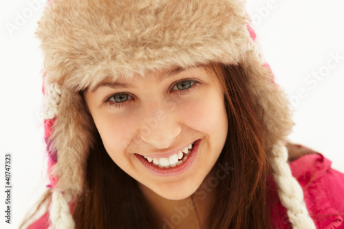 Photo: Portrait Of Teenage Girl In Snow Wearing Fur Hat Portrait Of Teenage Girl In Snow Wearing Fur Hat