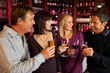 Photo: Group Of Friends Enjoying Drink Together In Bar Group Of Friends Enjoying Drink Together In Bar