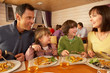 Family Eating Lunch Together In Restaurant