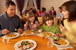 Foto: Family Eating Lunch Together In Restaurant Family Eating Lunch Together In Restaurant