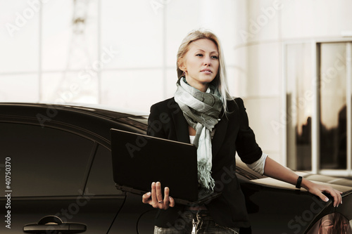 Photo: Young businesswoman with laptop Young businesswoman with laptop