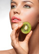 Beautiful woman with kiwi Beautiful woman with kiwi