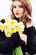 young beautiful girl with daffodils