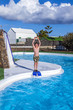 boy  jumping in the blue pool
