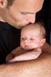 Photo: Dad kissing baby Dad kissing baby
