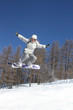 Flying snowboarder