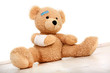 Teddybär mit einem Armverband