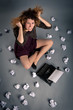 Young desperate girl writing with an old typewriter.