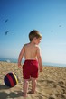 Baby boy on a beach.