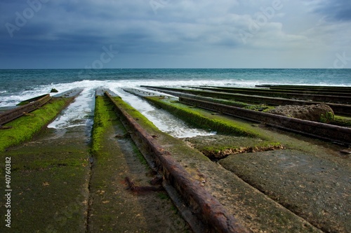 Photo: Old rails for descending boat into water. Old rails for descending boat into water.