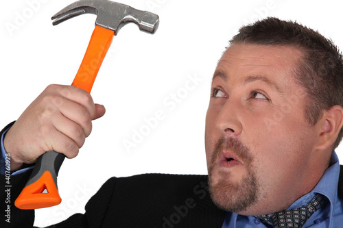 Photo: Businessman holding a hammer Businessman holding a hammer