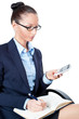 Business woman sitting on chair and looking at mobile phone