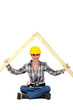 Female builder with a timber roof apex