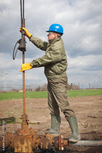Photo: Oil company worker on the well Oil company worker on the well