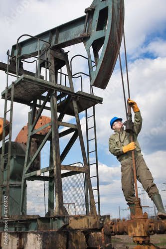 Photo: Oil company worker on the well Oil company worker on the well