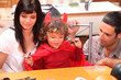 Parents and son preparing Halloween party