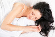 A fényképek részletei Cute woman sleeping on the white bed