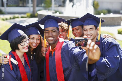 Photo: Graduates taking picture of themselves Graduates taking picture of themselves