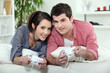 Young couple playing video games together Young couple playing video games together