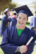 Smiling graduate carrying diploma
