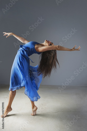 Photo: Dancer posing in ornate gown Dancer posing in ornate gown
