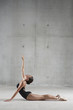 Ballet dancer posing on floor
