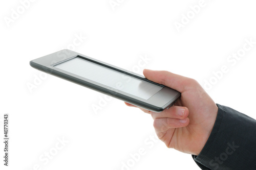 Photo: E-reader and hand. E-reader and hand.