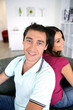 canvas print picture - Couple back to back at home