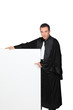 Man dressed in gown holding message board